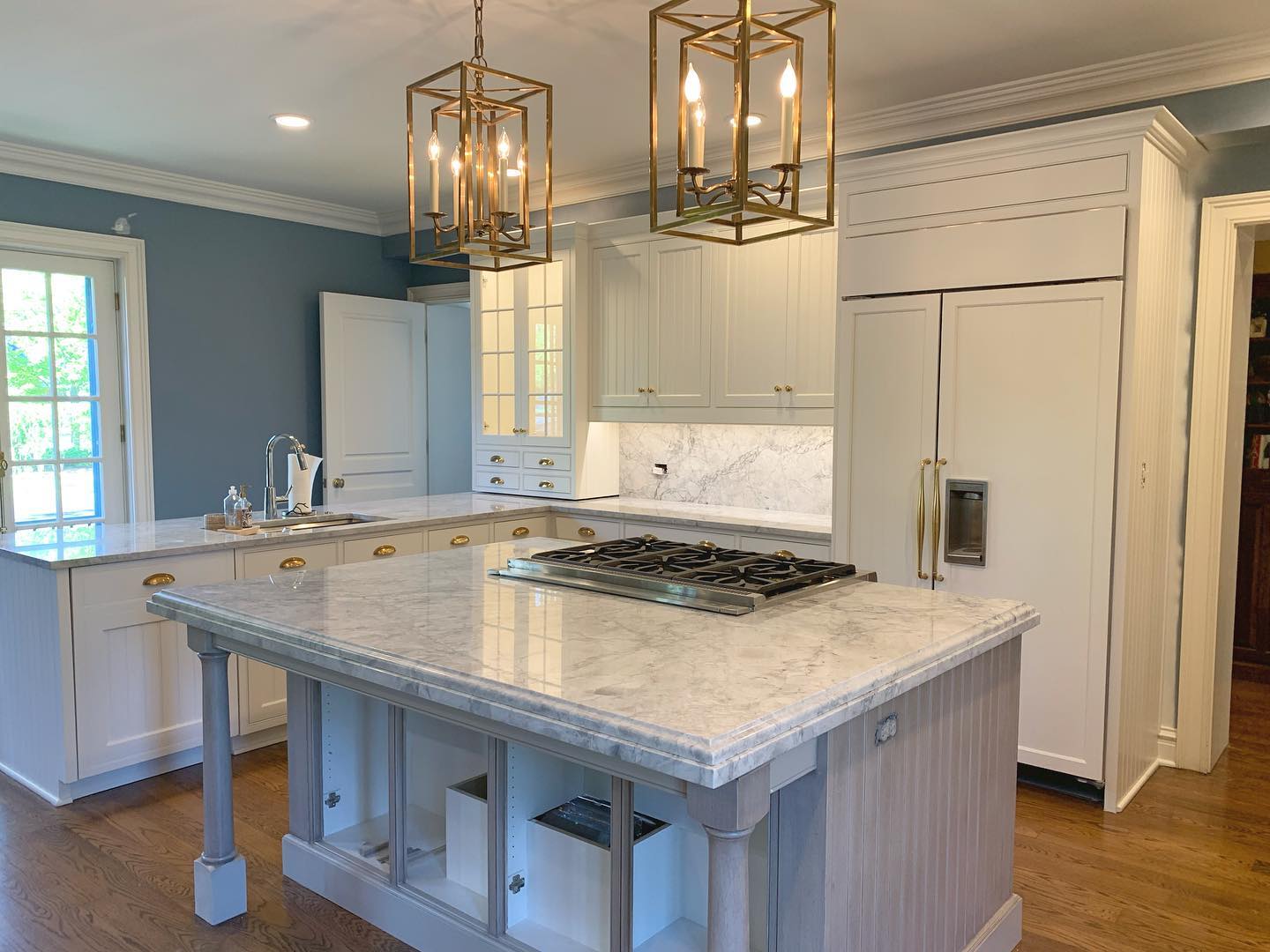 Traditional kitchen island finished with custom shaped stone edges